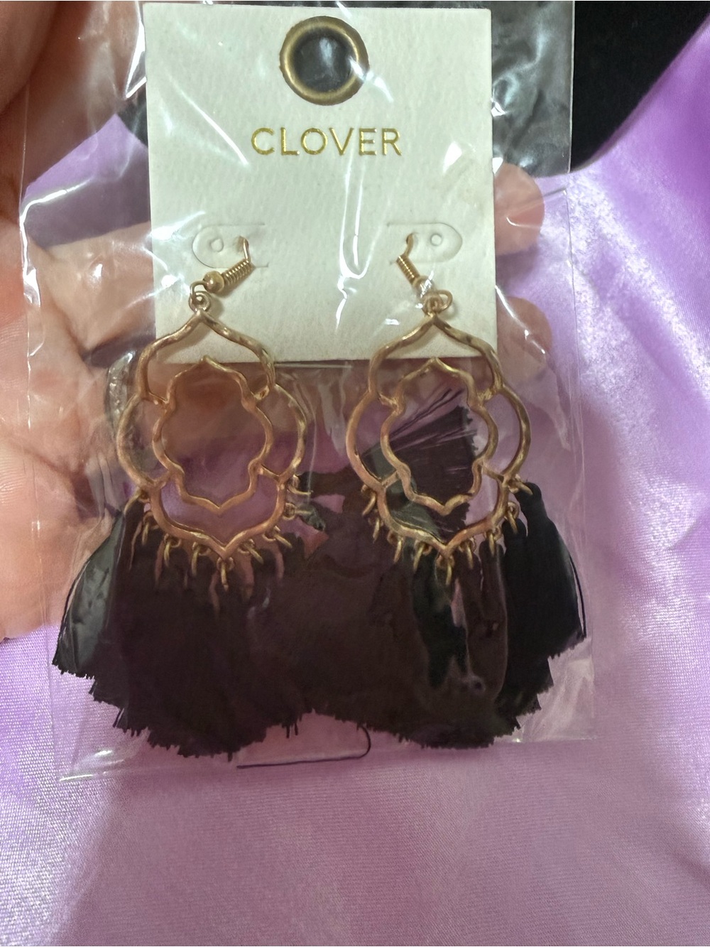 Clover Rose gold tone black tassel earrings.
